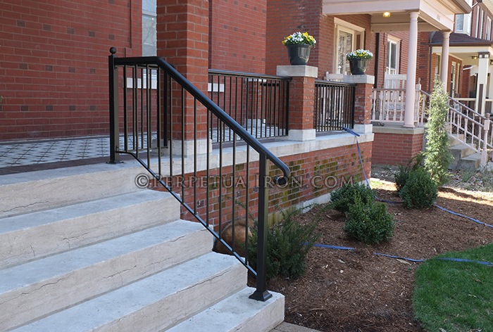 Contemporary simple design: round tubing handrail with heavy posts.